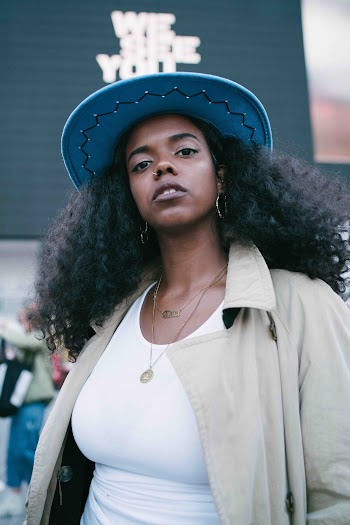 Selective Focus Photography of Woman Wearing  Collared Coat and  Cap