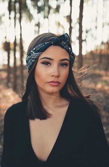 Selective Focus Photography of Woman Wearing Deep V-neck Top
