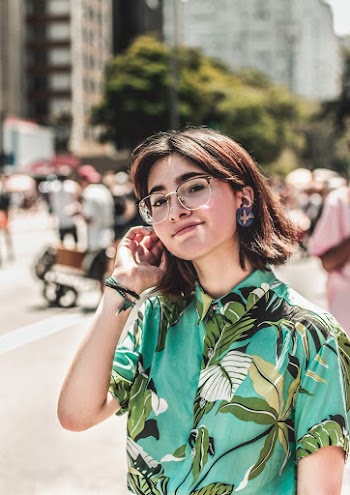 Selective Focus Photography of Woman Wearing Green Floral Button-up Shirt