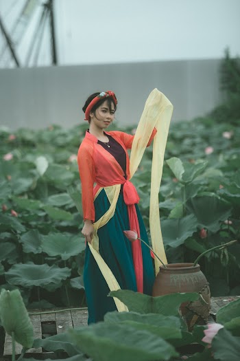 Selective Focus Photography of Woman Wearing Red and Green Dress