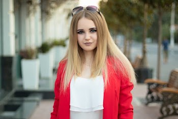 Selective Focus Photography Of Woman Wearing Red Cardigan