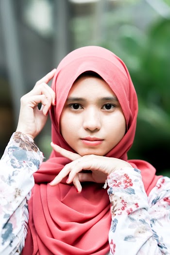 Selective Focus Photography of Woman Wearing Red Hijab