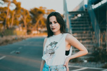 Selective Focus Photography of Woman Wearing Sleeveless Top