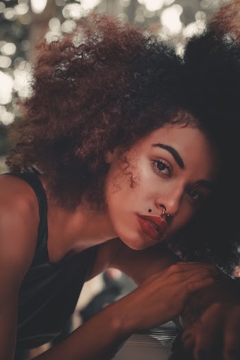 Selective Focus Photography of Woman Wearing Tank Top
