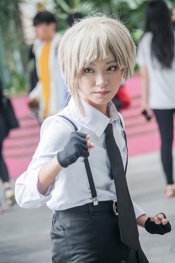 Selective Focus Photography of Woman Wearing White and Black Costume