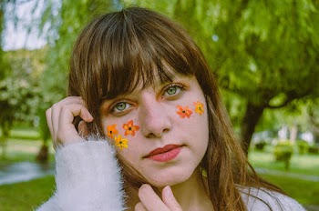 Selective Focus Photography of Woman With Flower Face Paint