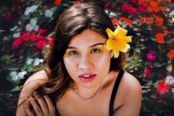 Selective Focus Photography of Woman With Flower on Ear