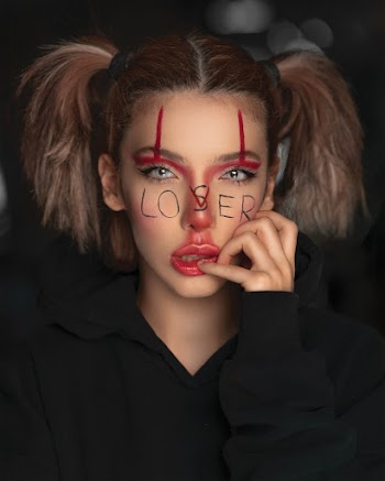 Selective Focus Photography of Woman With Lovser Face Paint