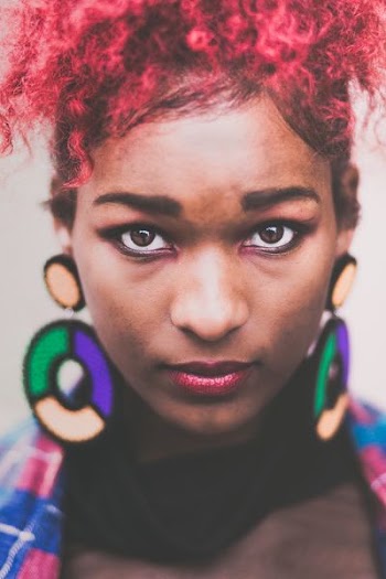 selective focus photography of woman with red hair