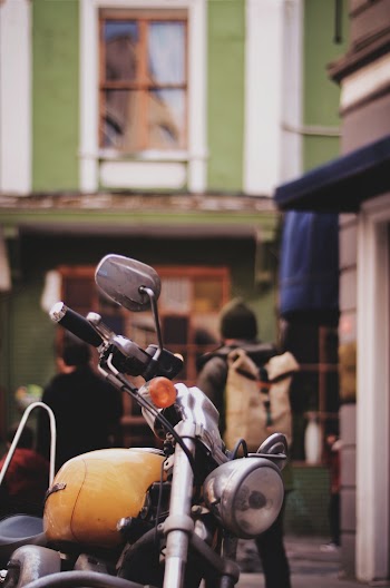 Selective Focus Photography of Yellow Motorcycle
