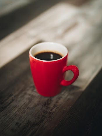 Selective Focus Photography Red Cup of Coffee