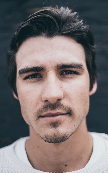 Selective Focus Portrait Photo of Man in White Top