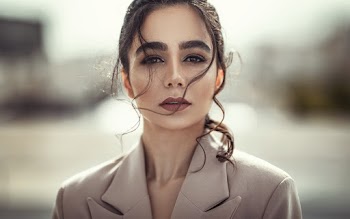 Selective Focus Portrait Photo of Woman in Beige Coat Posing