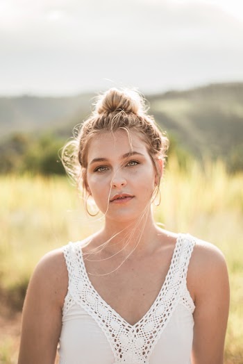 Selective Focus Portrait Photo of Woman in White Top