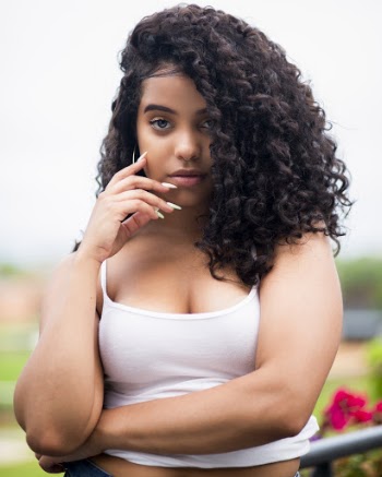 Selective Focus Portrait Photo of Woman in White Top Posing