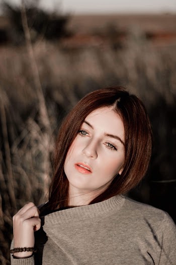 Selective Focus Portrait Photo of Woman Posing