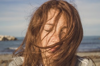 Selective Focus Portrait Photo of Woman Posing With Her Eyes Closed