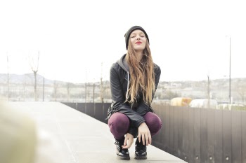 Selective Photo of Woman in Gray Hooded Jacket Doing Crouch Position