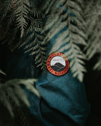 Selective Photography of a Mountain Expedition Team Badge