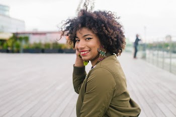 Selective Photography of a Woman in Green Jacket