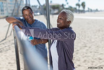 Senior couple exercising on beach