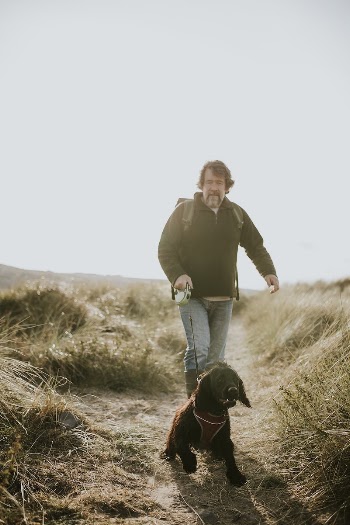 Senior man walking his dog | Free Photo - rawpixel