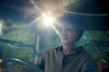 Senior woman driving a tractor, | Free Photo - rawpixel