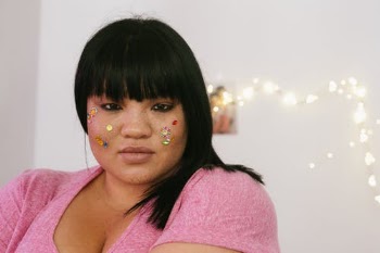 Sensual plus size female with shiny rhinestone on face looking at camera · Free Stock Photo