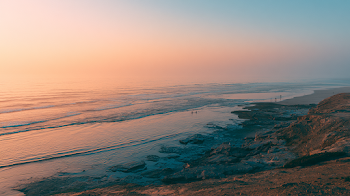 Serene Coastal Sunset with Silhouettes