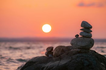 Serene Sunset Over Stacked Stones