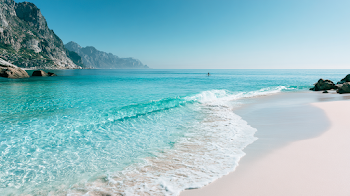 Serene Tropical Beach with Surfer Silhouette