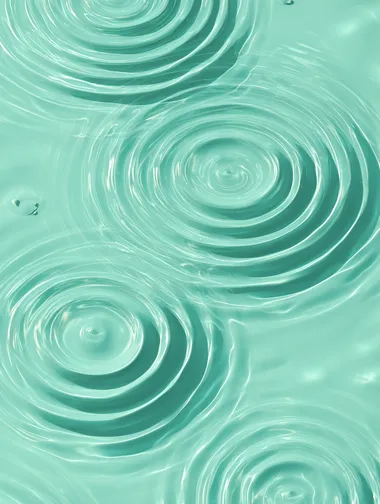 Serene Water Ripples on Light Green Surface Serene Water Ripples on Light Green Surface