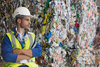 Serious male worker in recycling plant