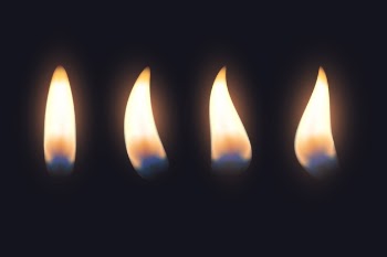Set of candle flames in the dark Free Vector