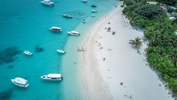 Several Boats Anchored Near Beach