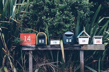 Several mailboxes on a post | Free Photo - rawpixel
