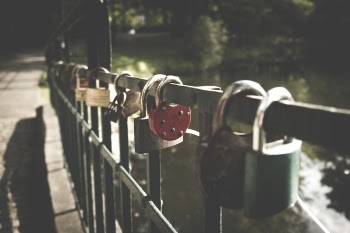 Several Padlocks on Bridge