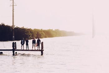 Several People Standing On Dock