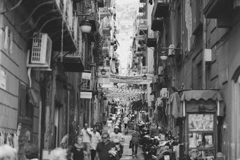 Several People Walking Across the Streets