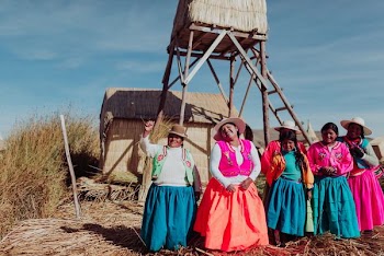 several women standing near tower