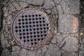 Sewer Grate In Pavement