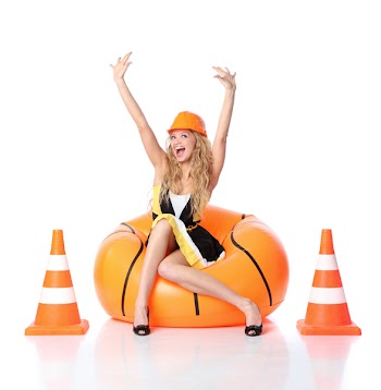 Sexy blond female construction worker being happy
