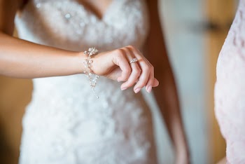 Shallow Depth of Field Photography of Woman Wearing Silver-colored Ring