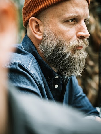 Shallow Focus Photo Of A Man's Profile With A Beard And Mustache Wearing A Beanie