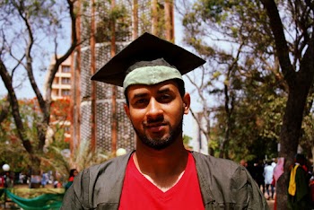 Shallow Focus Photo of a Man Wearing Academic Regalia