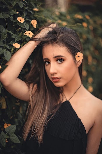 Shallow Focus Photo of a Woman in Black Sleeveless Top