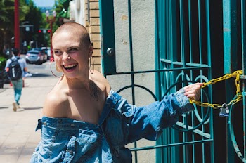 Shallow Focus Photo of a Woman in Blue Button-up Denim Jacket