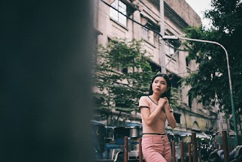 Shallow Focus Photo Of A Young Woman In Beige Crew-neck T-shirt