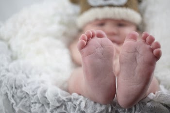 Shallow Focus Photo of Baby's Feet