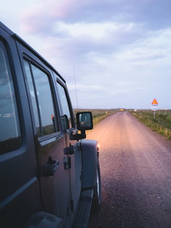 Shallow Focus Photo Of Black Vehicle